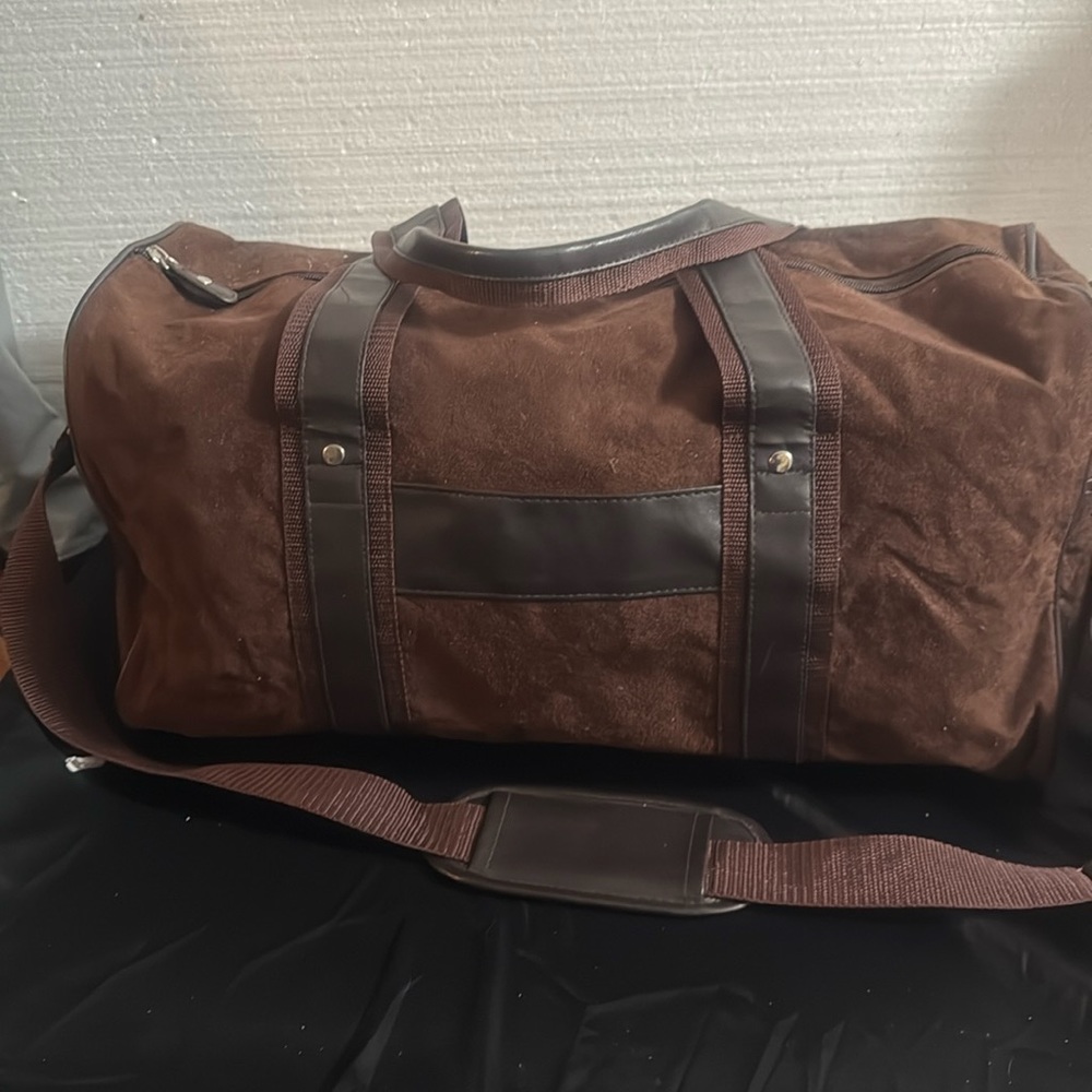 Brown suede duffle bag.